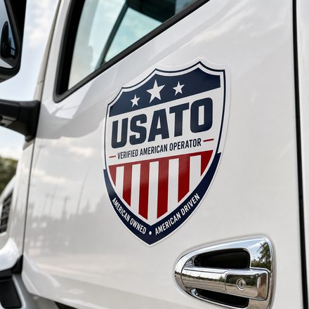 USATO Verified American Operator badge on an Enterprise Auto Transport truck