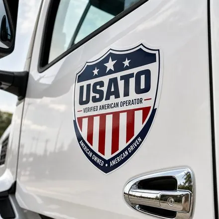 USATO Verified American Operator badge on an Enterprise Auto Transport truck